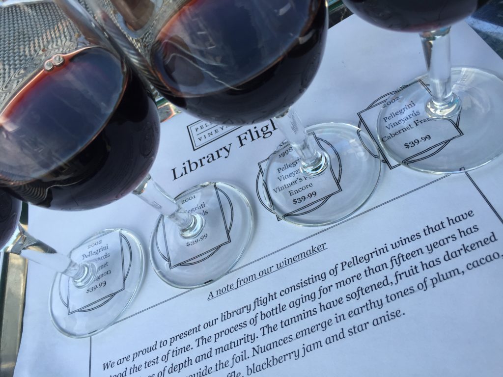 A close up of wine glasses on top of a table